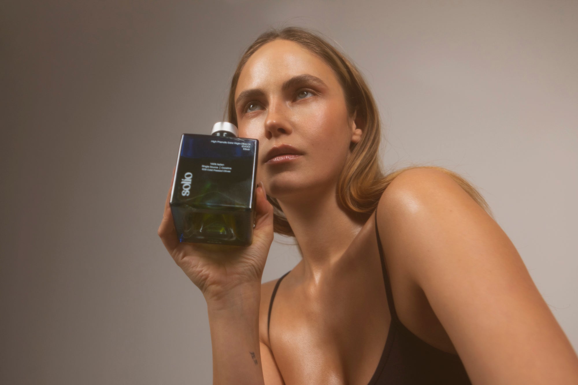 Holding Solio bottle